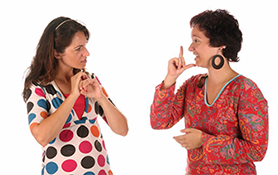 two women signing